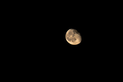 Low angle view of moon against clear sky at night