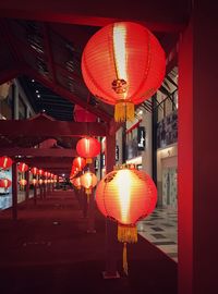 Illuminated lanterns hanging at night