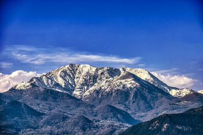 Scenic view of snowcapped mountains against sky