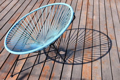 High angle view of empty chairs on deck