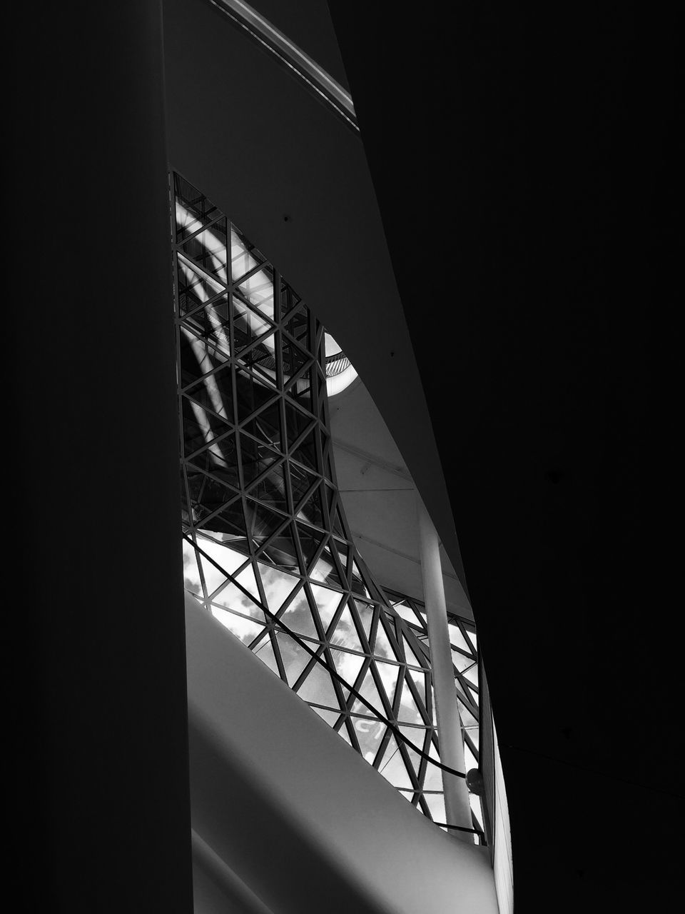 low angle view, built structure, architecture, transportation, clear sky, sky, metal, indoors, building exterior, connection, no people, part of, directly below, building, day, engineering, cropped, geometric shape, railing