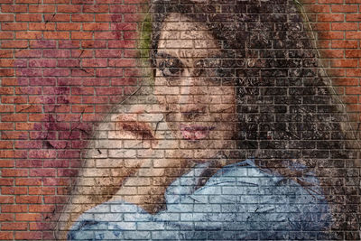 High angle view of woman on brick wall