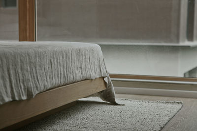 Close-up of chair on bed at home