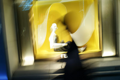 Side view of people walking in bus