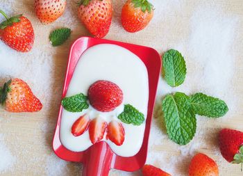 High angle view of strawberries on table
