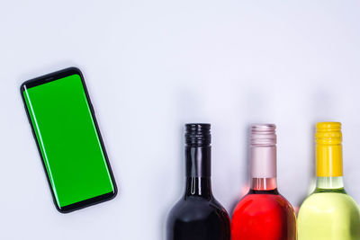 Close-up of bottles against white background