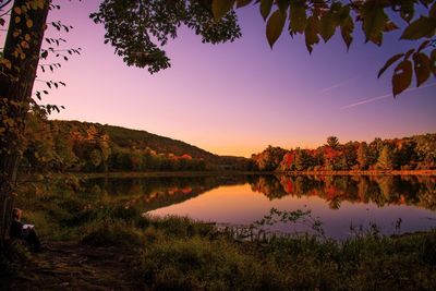 Scenic view of calm lake at sunset