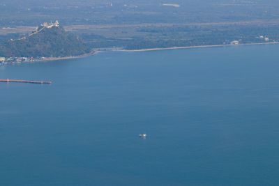 High angle view of sea by mountain