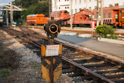 Abandoned signal by railroad tracks