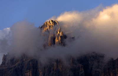 Rocky landscape against clouds