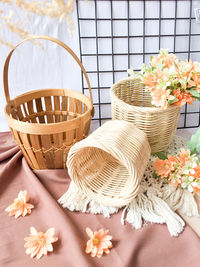 High angle view of flowering plant in basket on table