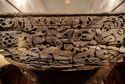 Close-up of ornate carving on wood