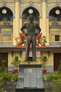 Low angle view of statue against historic building