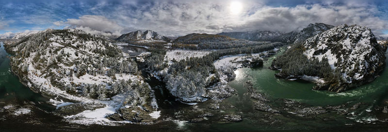 Panoramic view of waterfall against sky