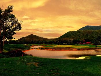 Scenic view of landscape against cloudy sky