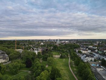 High angle view of city buildings against sky