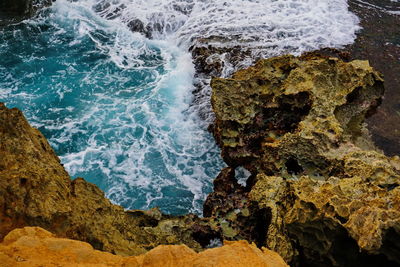 High angle view of rocks in sea