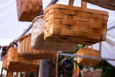 Low angle view of baskets hanging