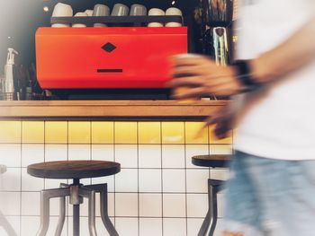 Blurred motion of man with umbrella on table