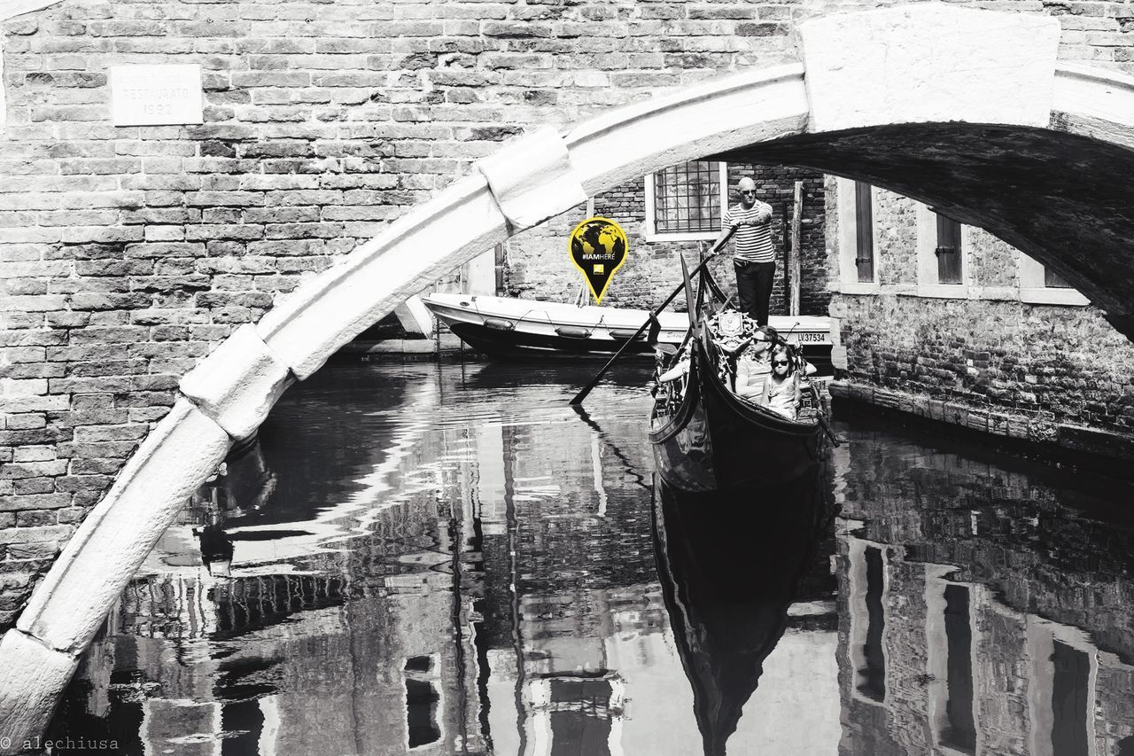 BUILDINGS WITH CANAL IN FOREGROUND