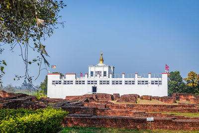 View of historical building against clear blue sky