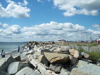 Scenic view of sea against cloudy sky