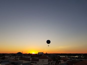 Hot air balloon against sky during sunset