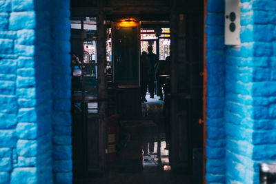 People seen from doorway of restaurant