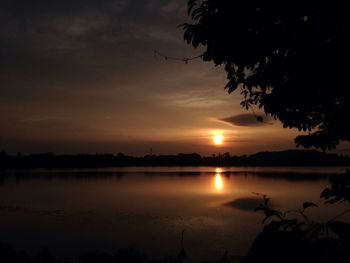 Scenic view of lake against sky during sunset