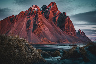 Scenic view of snowcapped mountains against sky during winter
