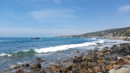 Scenic view of sea against blue sky