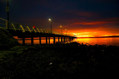 Bright orange sunrise over a australian jetty 