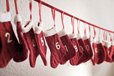 Close-up of clothespins hanging on wall