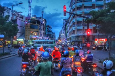 Rear view of people on city street