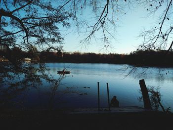 Scenic view of lake against sky during sunset