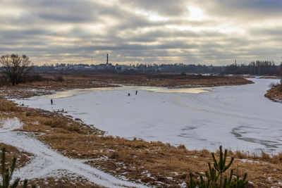 Scenic view of frozen lake against sky