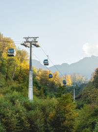 Overhead cable car against sky