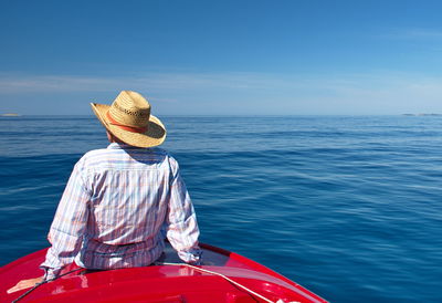 Portrait of senior woman on the boat against clear blue adriatic sea