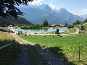 Scenic view of lake and mountains against sky