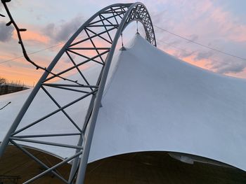 Low angle view of tower against sky during sunset