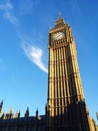 Low angle view of tower against blue sky