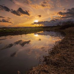 Scenic view of landscape against cloudy sky