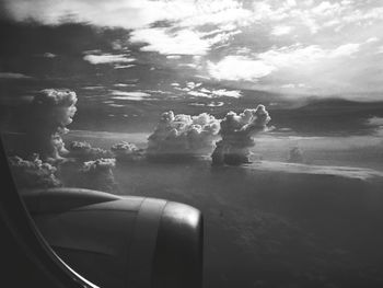 Low angle view of cropped car against sky