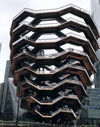 Low angle view of buildings in city against sky