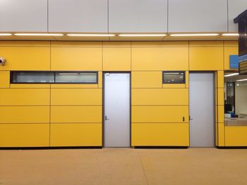 Closed doors in yellow building