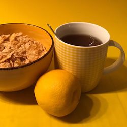 Close-up of yellow eggs in bowl on table