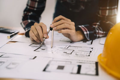 Midsection of man working at office