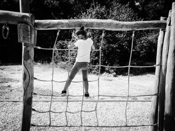 Full length of boy playing in playground