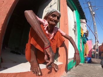 Portrait of smiling woman holding umbrella