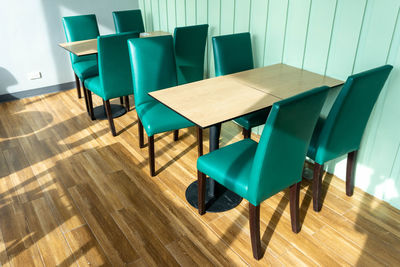 High angle view of empty chairs on table
